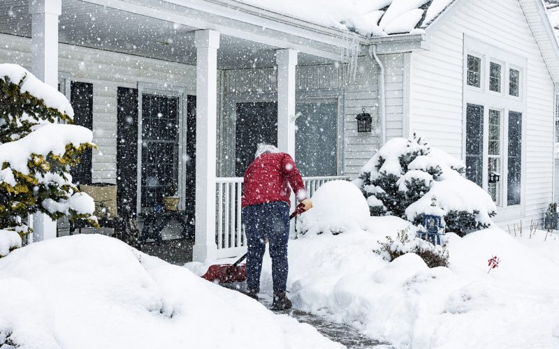 Woman Shoveling Snow