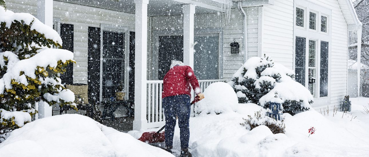 Woman Shoveling Snow