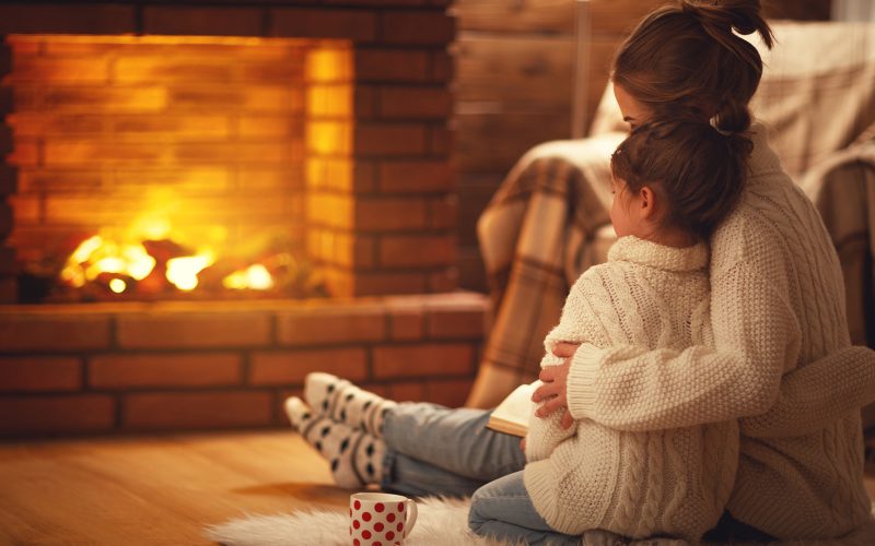 Mother and Child By Fireplace