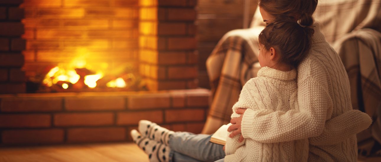 Mother and Child By Fireplace