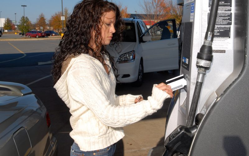 Woman Pumping Gas