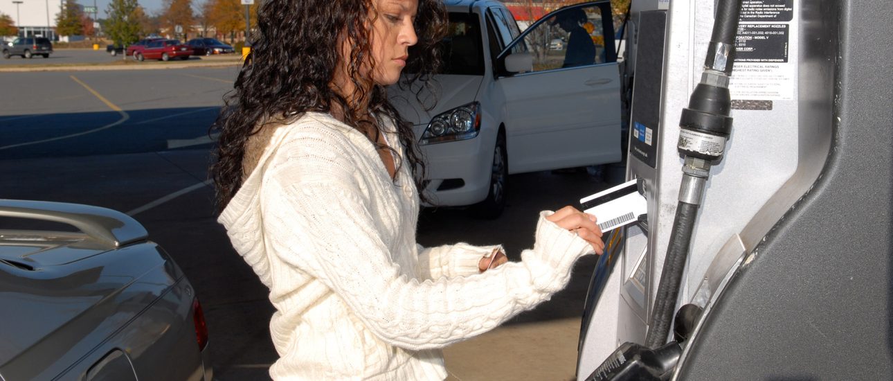 Woman Pumping Gas