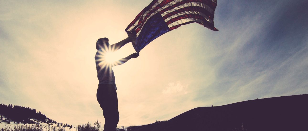 Man Flying American Flag